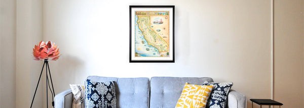 California State hand-drawn map hanging over a light blue couch. 