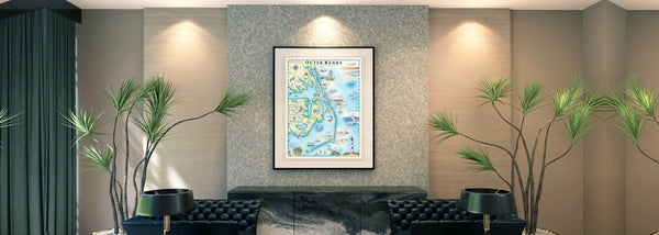 North Carolina's Outer Banks hand-drawn map hangs on a wall in an elegant room with fan plants. 