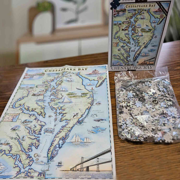 Chesapeake Bay Puzzle on a table with the Map poster and puzzle box. 