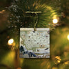 Montana ornament hanging from a tree with gold ribbon.
