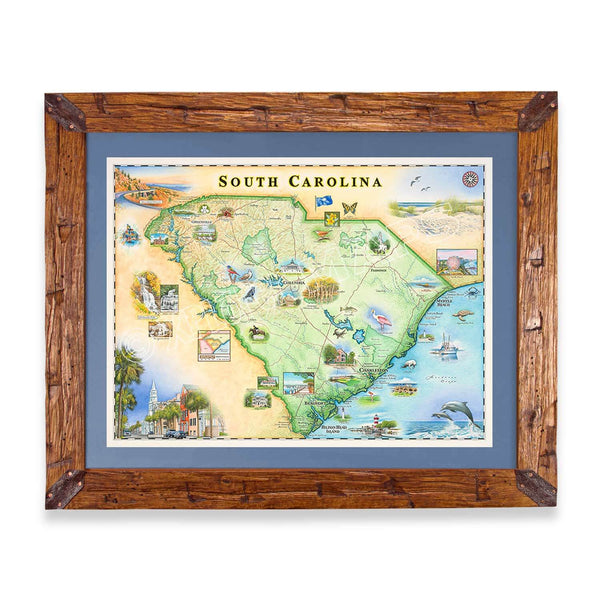 Montana Scraped Pine Frame with Blue Mat of South Carolina map by Chris Robitaille features landmarks like Charleston, Myrtle Beach, Hilton Head Island, and Congaree National Park. Highlighting Columbia, Greenville, and more, this 24"x18" art print captures South Carolina's charm.