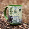Green 16 oz Yosemite National Park Ceramic Mug with handle sitting on a log in a forest.