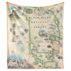 Hanging fleece blanket featuring a Black Hills National Forest map. The map features Mount Rushmore, Jewel Cave National Monument, Custer State Park, and Devil's Tower. The map also includes flora and fauna of areas such as Bison, Elk, Big Horn Sheep, Bald Eagle, Rocky Mountain Iris, and Buffalo Berries.