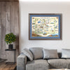 Colorado State hand-drawn map in a gray frame with blue mat The map is hanging on a wall above a gray couch.
