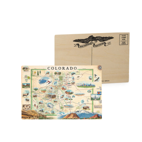 Colorado State Map Wooden Postcard  4" x 4"  by Xplorer Maps that showcases various cities including Denver, Fort Collins, Colorado Springs, Aspen, and Durango. It also features local flora and fauna, such as moose, Rocky Mountain elk, turtles, eagles, and Bighorn Sheep, as well as the indigenous Navajo and Hopi peoples. The map highlights popular activities like hiking, biking, rafting, and skiing. 