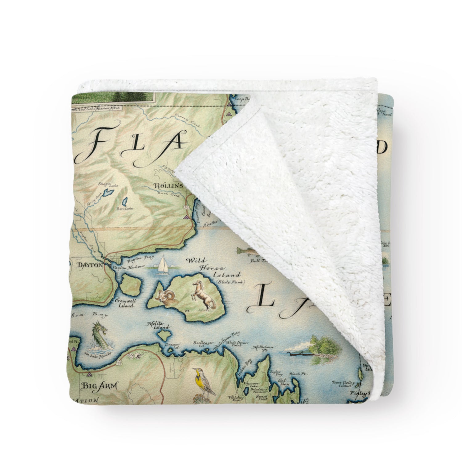 A folded blanket with a map of Flathead Lake in Montana on it. Hand-drawn artwork. Blanket measures 58