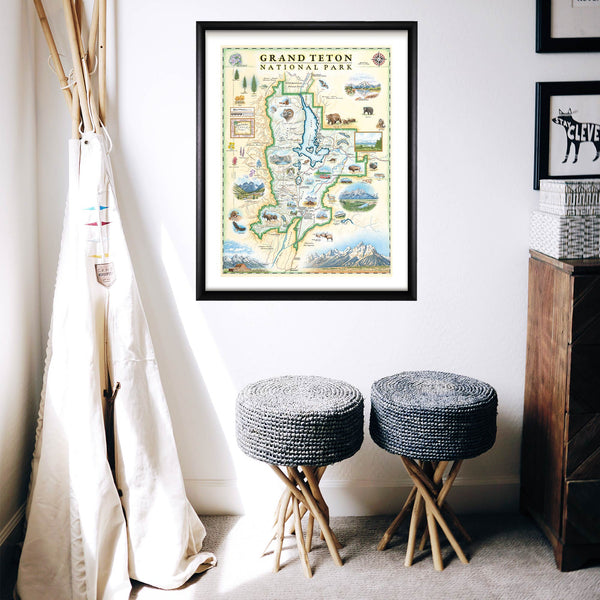 Grand Teton National Park hand-drawn map in a black frame hanging on a wall next to a teepee tent in a child's toy room.