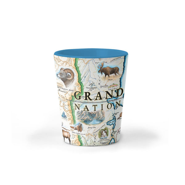 Grand Teton National Park Map Ceramic shot glass by Xplorer Maps. Map illustrations include flora and fauna of the area, such as grizzly bears, moose, coyote, lupine, and longleaf phlox. Illustrations of places include snake river overlook, jenny lake, and Colter Bay Village.