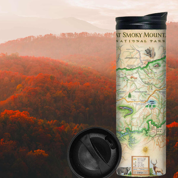 Great Smoky Mountains National Park Map travel drinkware with colorful red, orange, and green leaves on trees during sunset. The map depicts the entire National Park on the border of North Carolina and Tennessee. It features illustrations of a salamander, woodpecker, Clingman's Dome, Sugarland's Visitor Center, and Oconoluftee Visitor Center.