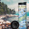 Isle Royale National Park travel mug on a rocky beach near water and pine trees. The map features flora and fauna such wolf, moose, Pink Lady Slippers, and Thimbleberries. Other illustrations include Lookout Louise, Rock of Ages Lighthouse, and the Rocky Harbor Lodge.
