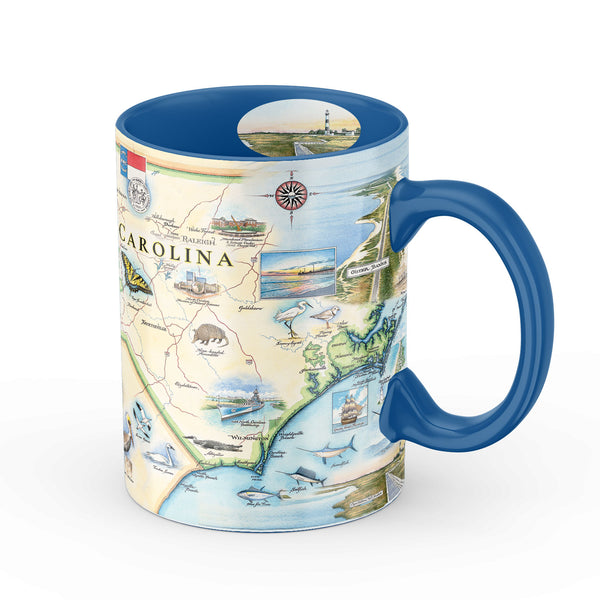 Blue 16 oz North Carolina state map ceramic coffee mug. The Cup features butterfly, armadillo, dolphins, Atlantic Ocean, Outer Banks, Clingmans Dome, Blue Ridge Parkway, Raleigh, Charlotte, Asheville, Greensboro, Wilmington, pelicans, and seabirds.