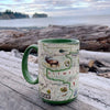 Green 16 oz Olympic National Park Map Ceramic coffee mug on an ocean log. Features: bald eagle, black bears, butterflies, marmot, Mount Olympus, Rainforest, Roosevelt Elk, waterfalls, flowers.