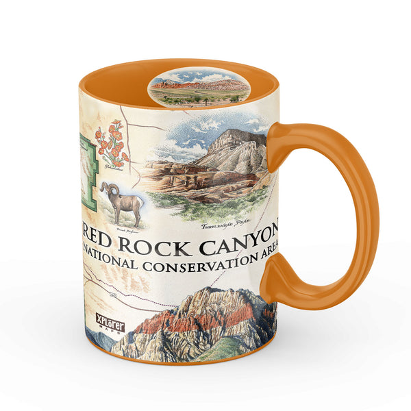 Orange Red Rock Canyon National Conservation Area Ceramic Mug with illustrations of Mt. Willson, Rainbow Mountain, Bridge Mountain, Spring Mountain Ranch. Featuring red-tail hawk, desert Bighorn, Globemallow, Joshua tree, Prickly pear cactus.