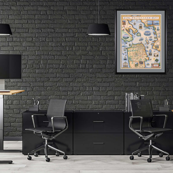 San Francisco Bay Map hanging on a black wall and black furniture office. The print is in a black frame with a gray mat.