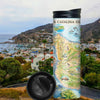 Santa Catalina Island Travel thermos mug with city and mountains in the background. The map features illustrations of places such as Wrigley Memorial, El Rancho Escondido, and Avalon Bay. Flora and fauna include Bison, Catalina Island Fox, Catalina Orange Lip butterfly, Channel Islands tree poppy, and Island oak.