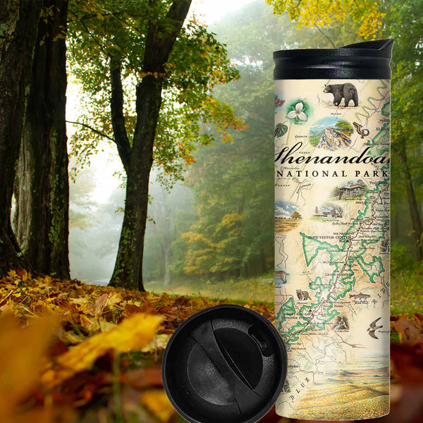 Shenandoah National Park Map travel thermos mug with forest with yellow and green leaves. The map includes illustrations of places such as Skyline Drive, Byrd Visitor Center, and Big Meadows Lodge. Flora and fauna include bobcats, wild turkeys, trillium flowers, a dogwood tree, and a black bear with cubs. 