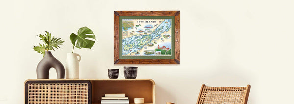 Caned furniture and plants in arched vases with the 1000 Islands framed map art by Chris Robitaille.