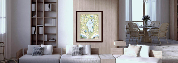 Lake Tahoe hand-drawn map in a family room hanging on a wall over a white couch. 
