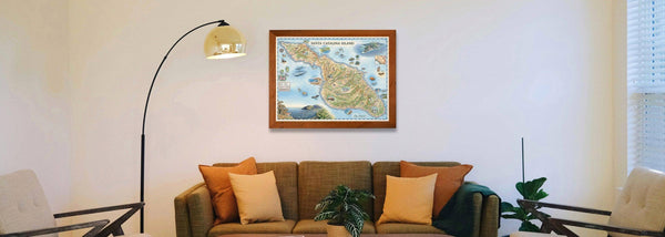 Beautiful map of Santa Catalina Island above a brown couch with a gold lamp on the side. 