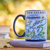 Mug with a map design of the 1000 Islands on top of a book