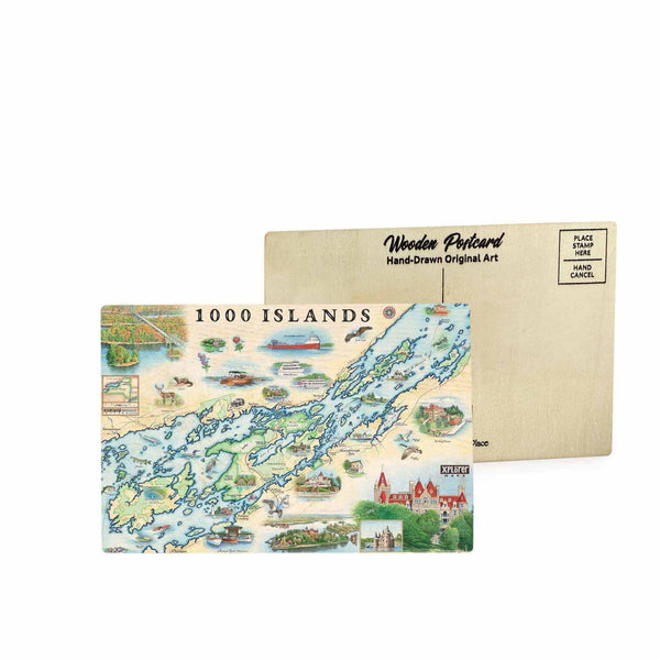 1000 Islands map wooden postcard in earth tone blues and greens featuring hand-drawn illustrations of Boldt Castle, Singer Castle, and the St. Lawrence River region.
