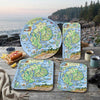 Set of Acadiana National Park-themed serving trays on a wooden table with scenic background.