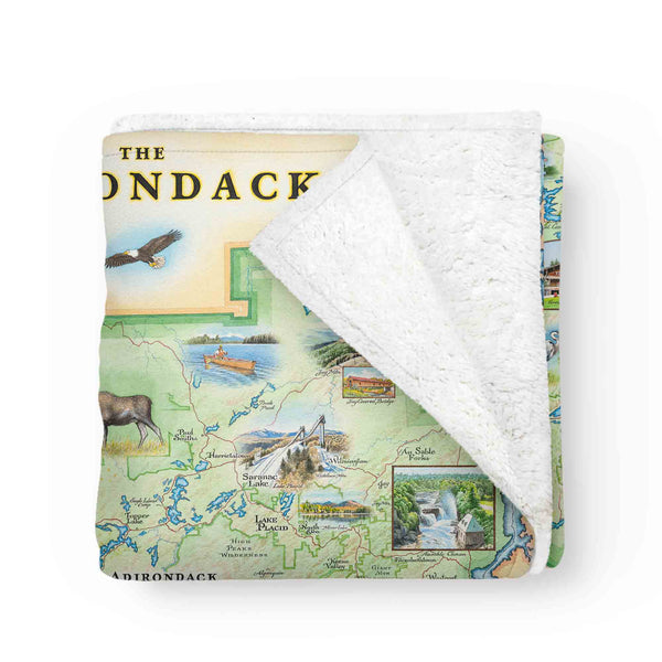 Folded Adirondacks Map Fleece Blanket showcasing soft Berber fleece lining.