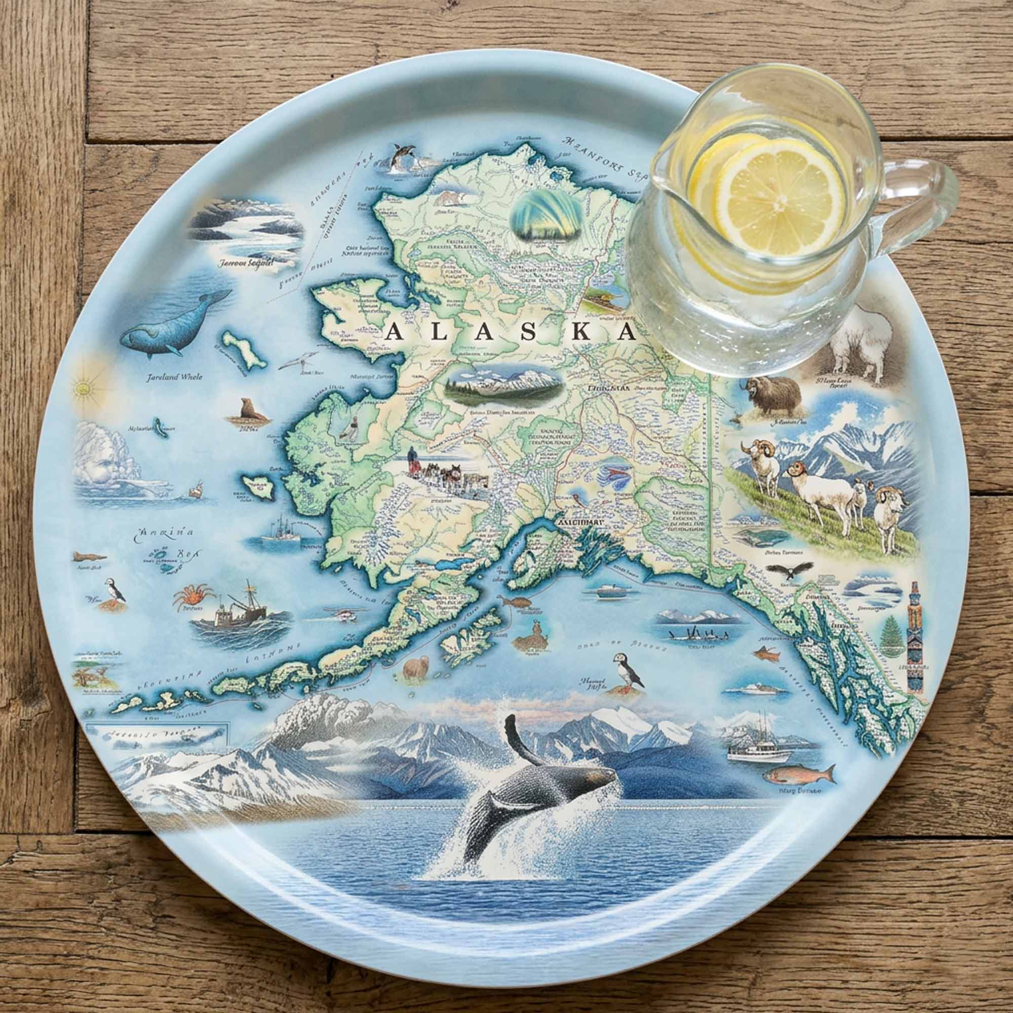 Serving Tray Map of Alaska on a decorative tray with a glass of lemon water.