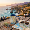 Mug with California map design on a wooden table with scenic ocean view