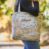 Person holding a tote bag with a map design of Cape Cod.