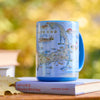 Cup with Cape Cod map design on a book outdoors