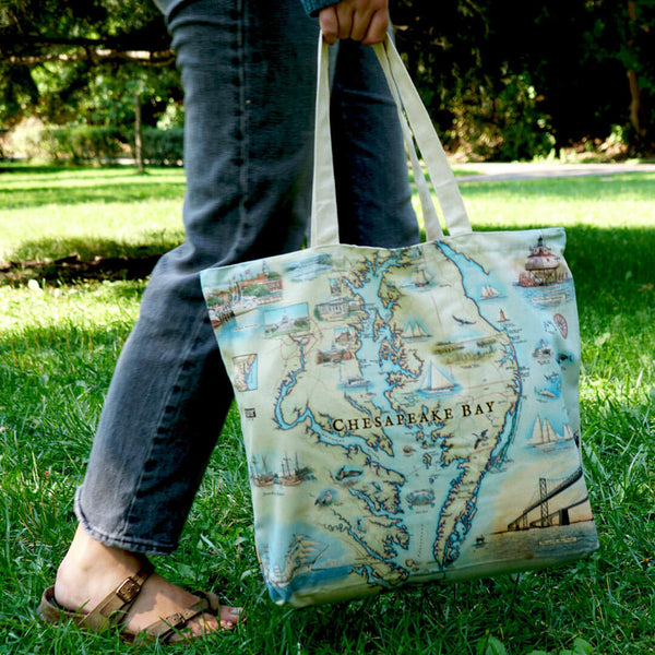 Chesapeake Bay canvas tote bag carried a person in a park like setting.