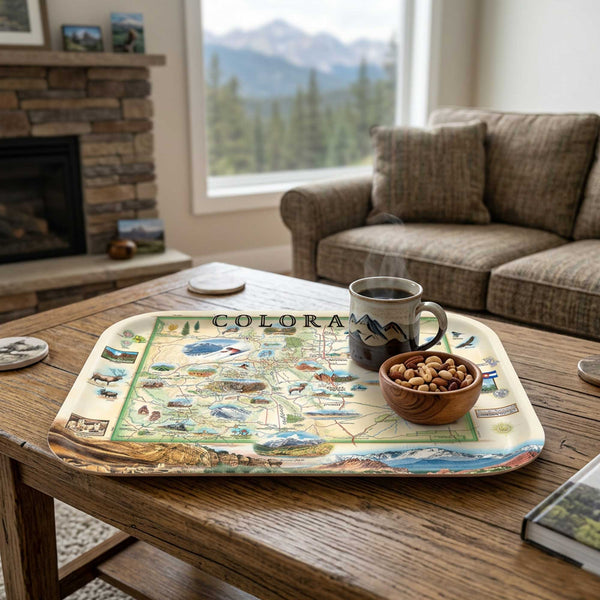 Tray with a Colorado map design on a wooden table in a cozy living room.