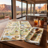 Dish Towel with scenic placemats and a glass of iced tea in a room with large windows showing a desert landscape.
