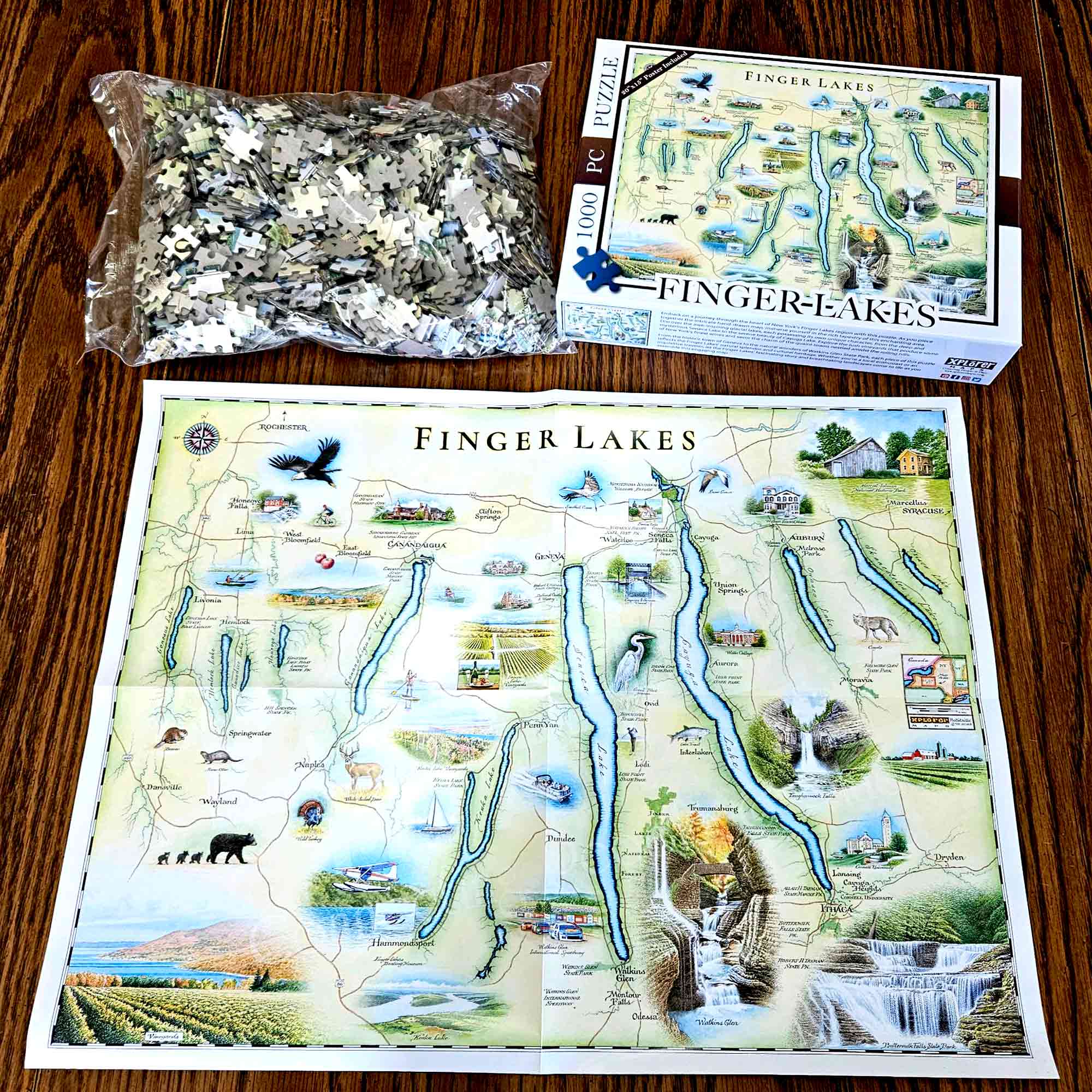 Finger Lakes puzzles taken out of box. Inside the box is a poster for reference. 