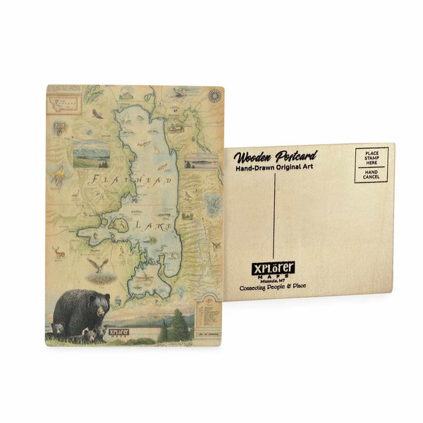 Flathead Lake Map wooden postcard in earth tone colors featuring hand-drawn illustrations of the lake, nearby towns, forests, black bear with cubs, and native wildlife.
