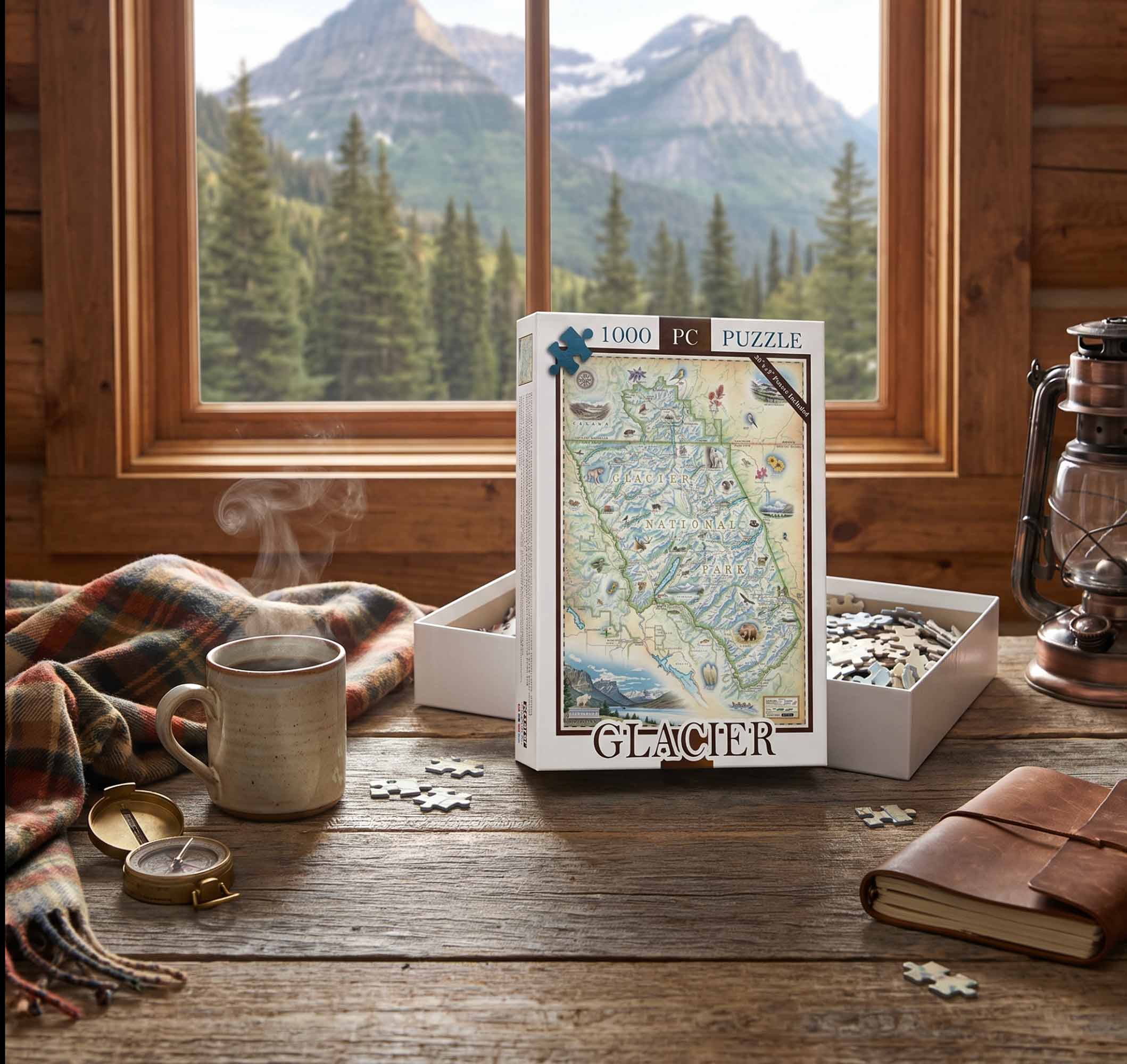 A 1000-piece jigsaw puzzle box labeled 'GLACIER' stands on a rustic wooden table in a cabin setting, with an open box of loose puzzle pieces beside it. A mug, scarf, lantern, notebook, and mountain landscape visible through the window create a cozy outdoor-themed scene.