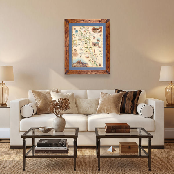 Utah's Capitol Reef National Park in a Montana hand-scraped pine wood frame with a blue mat hanging above a white couch.
