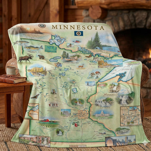 Minnesota-themed blanket with map design draped over a chair in a cozy room.