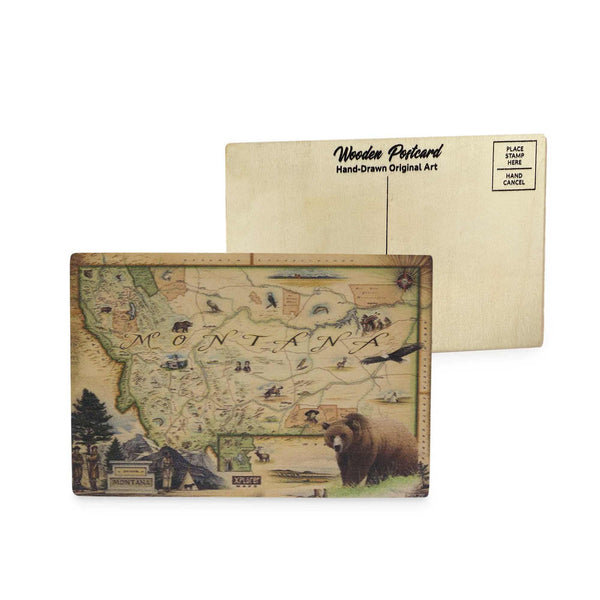 Montana State Map wooden postcard in earth tones featuring a grizzly bear, Sacajawea, Lewis and Clark, and hand-drawn illustrations of iconic Montana landmarks.
