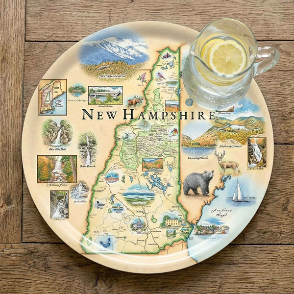 Serving Tray Map of New Hampshire on a decorative plate with a glass of water and lemon.