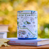Ceramic mug with North Carolina map design on a book against a blurred natural background