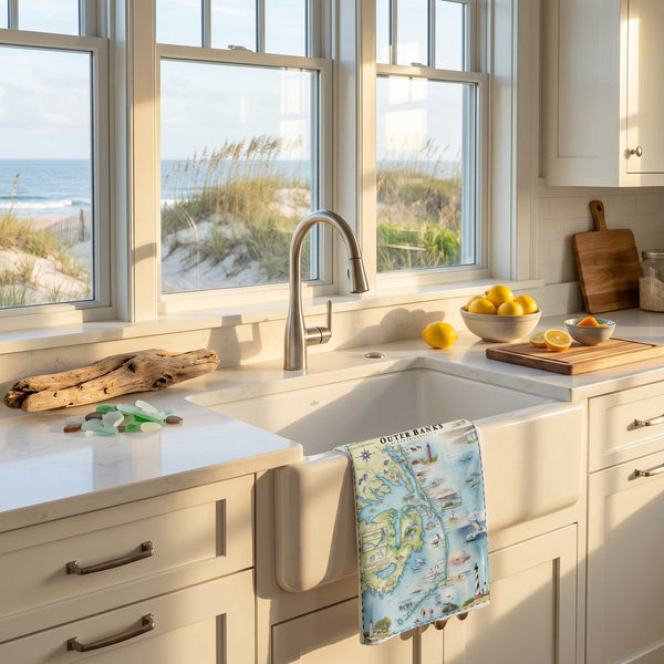 Kitchen with a sink and window view of beach scenery