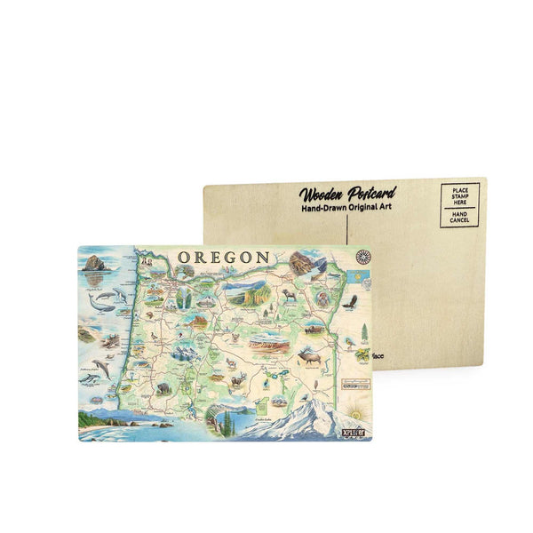 Oregon State Map wooden postcard in earth tone colors featuring hand-drawn landmarks like Crater Lake, Mount Hood, and wildlife including salmon and bald eagles.