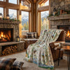 Cozy living room with stone fireplace, wooden furniture, and mountain view.