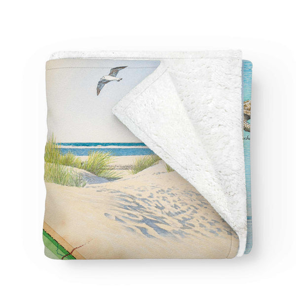 South Carolina Map Fleece Blanket neatly folded with one corner pulled back, revealing the soft fleece lining and detailed map artwork.