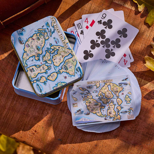Playing cards with San Juan Islands map design on a wooden surface
