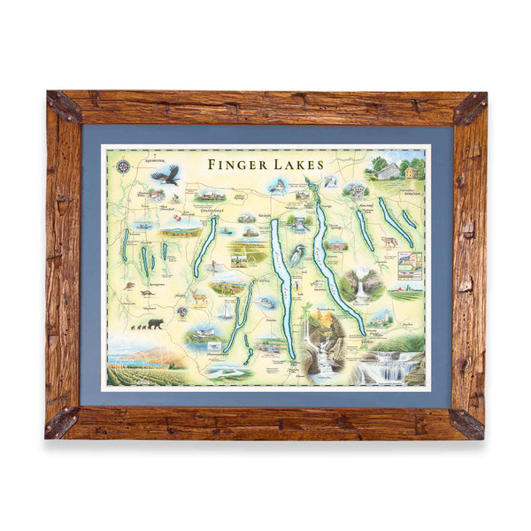 Finger Lakes hand drawn map in greens and blues. The map features Ithaca, Glen Watkins, Syracuse,  and Rochester.  Waterfalls, bald eagles, Deer and black bear are featured on the map. The map is frames in Montana scraped pine in a blue mat.