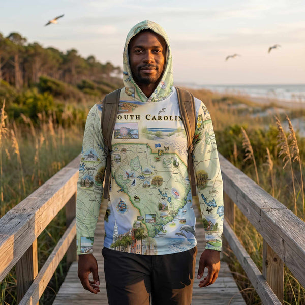 Person wearing a South Carolina-themed hoodie standing on a wooden boardwalk with a scenic background.