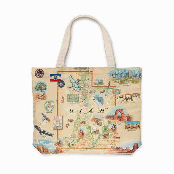 A large canvas tote bag with an intricate map of Utah, featuring highlights like Salt Lake City, Moab's Arches National Park, Bryce Canyon, Capitol Reef, Zion National Park, Dinosaur National Monument, and scenic landscapes depicting the state's diverse flora and fauna.